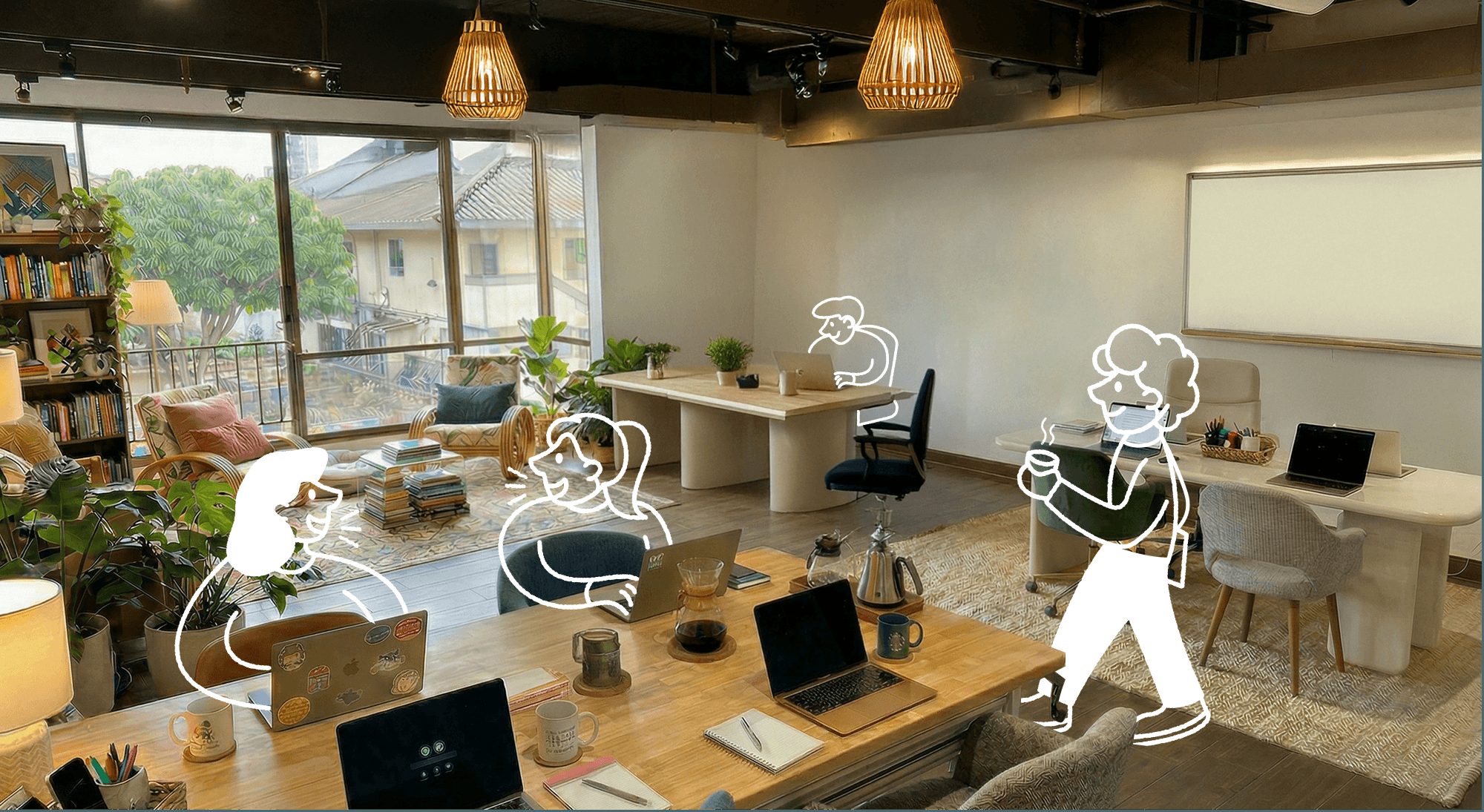 Sunny open-plan loft workspace with desks, plants, and pour-over coffee